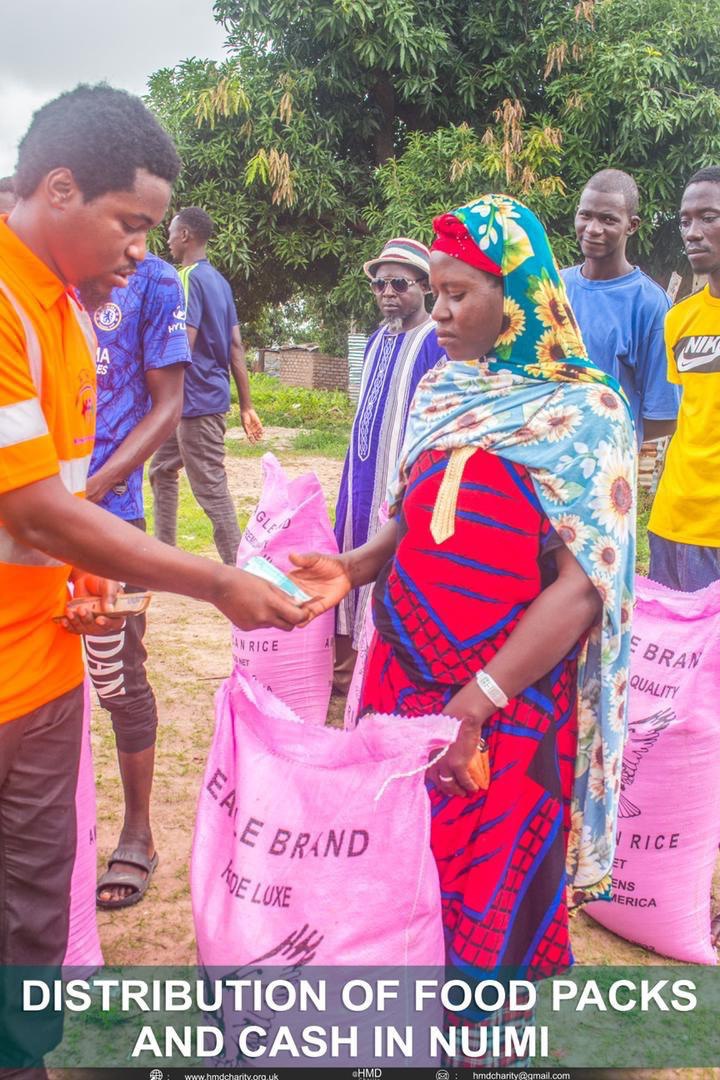 Li Wajhillah distributing food packs in the community